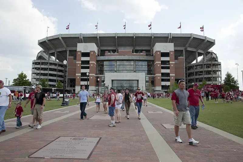 Fans walking the Walk of Champions plaza outside Bryant-Denny Stadium's north side on game day