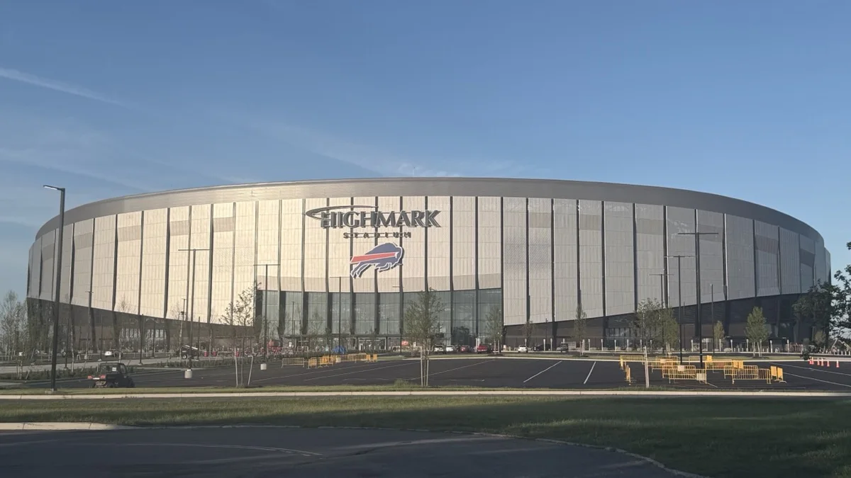 The completed exterior of the new Highmark Stadium in Orchard Park, seen from the west with the Buffalo Bills logo on its metal facade