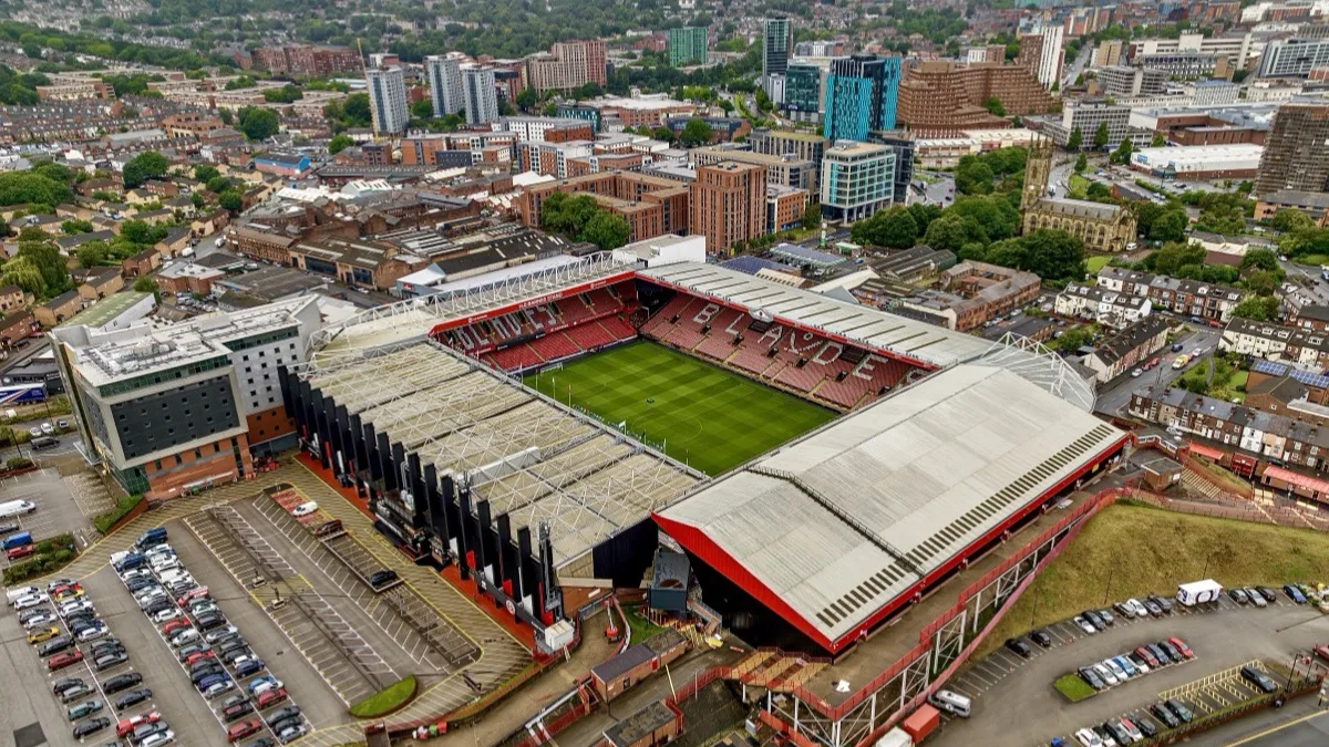 Aerial view of Bramall Lane, Sheffield, with BLADES picked out in the seats and the city center behind