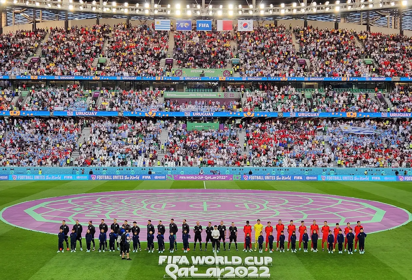 Education City Stadium packed for a 2022 World Cup match, the teams lined up before kickoff